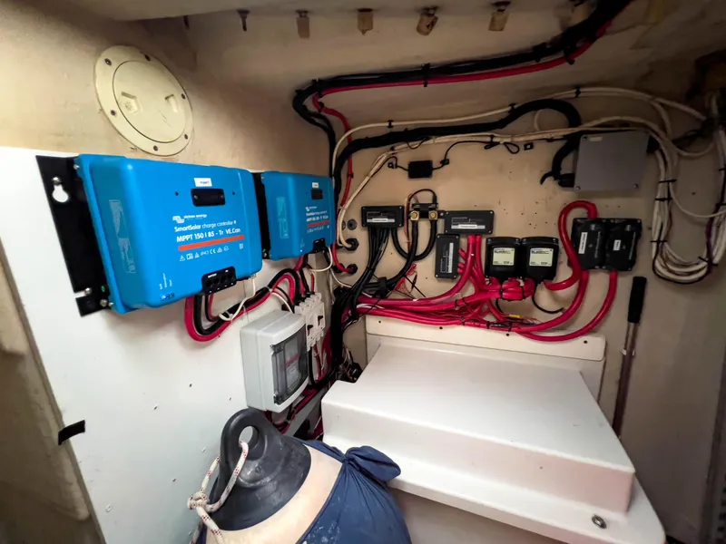 Slide: The Image of Electrical system setup in a 2005 Antares PDQ 44 boat, featuring wiring and control panels. - 18