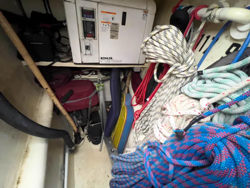 Slide: The Image of Storage area in a 2005 Antares PDQ 44 with ropes and a Kohler power system. - 24