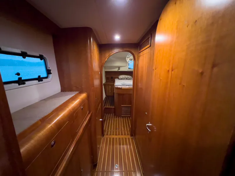 Slide: The Image of Luxurious wooden interior of 2005 Antares PDQ 44 yacht cabin with cozy lighting. - 32