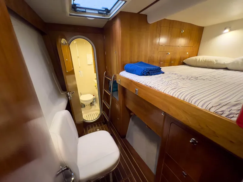 Slide: The Image of Luxurious cabin interior of 2005 Antares PDQ 44 yacht with bed and bathroom. - 33