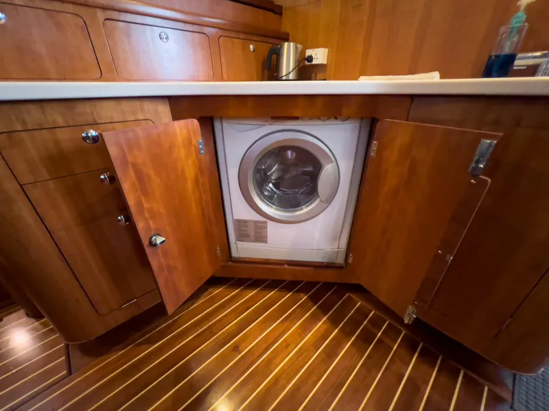 Slide: The Image of Washer in wooden cabinet on Antares PDQ 44 yacht, 2005 model. - 37