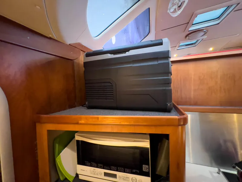 Slide: The Image of Interior of 2005 Antares PDQ 44 with microwave and storage unit. - 42