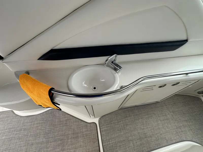 Slide: The Image of 2003 Sea Ray 420 Sundancer yacht interior with sink and orange towel. - 12