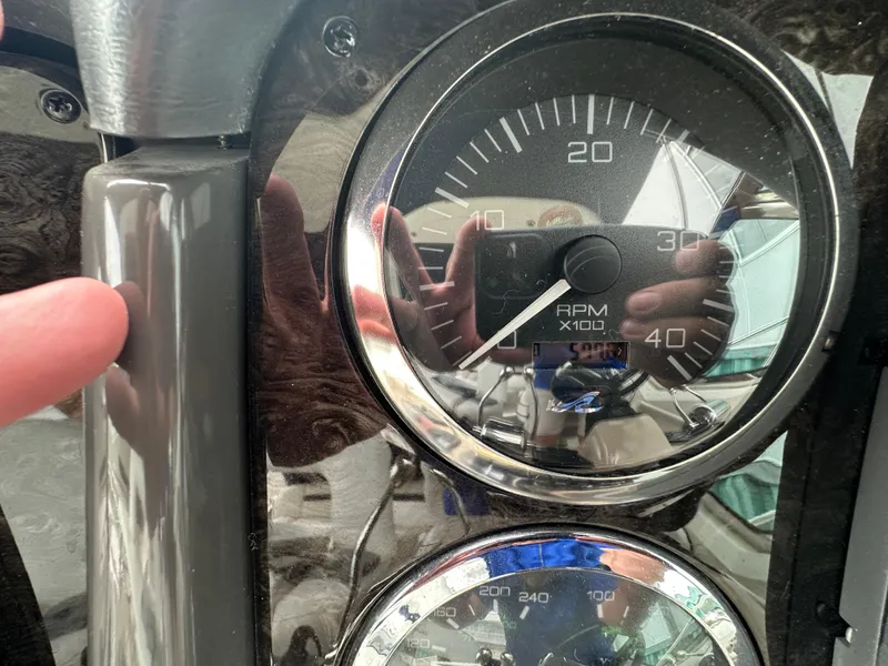 Slide: The Image of Close-up of 2003 Sea Ray 420 Sundancer RPM gauge with reflection. - 26