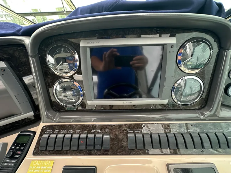 Slide: The Image of Dashboard of a 2003 Sea Ray 420 Sundancer with Garmin GPS and gauges. - 27
