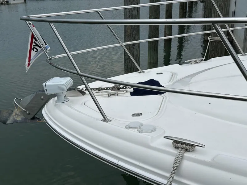 Slide: The Image of Bow of a 2003 Sea Ray 420 Sundancer yacht docked at a marina. - 3