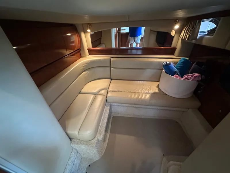 Slide: The Image of Luxurious interior of 2003 Sea Ray 420 Sundancer yacht with beige leather seating. - 34