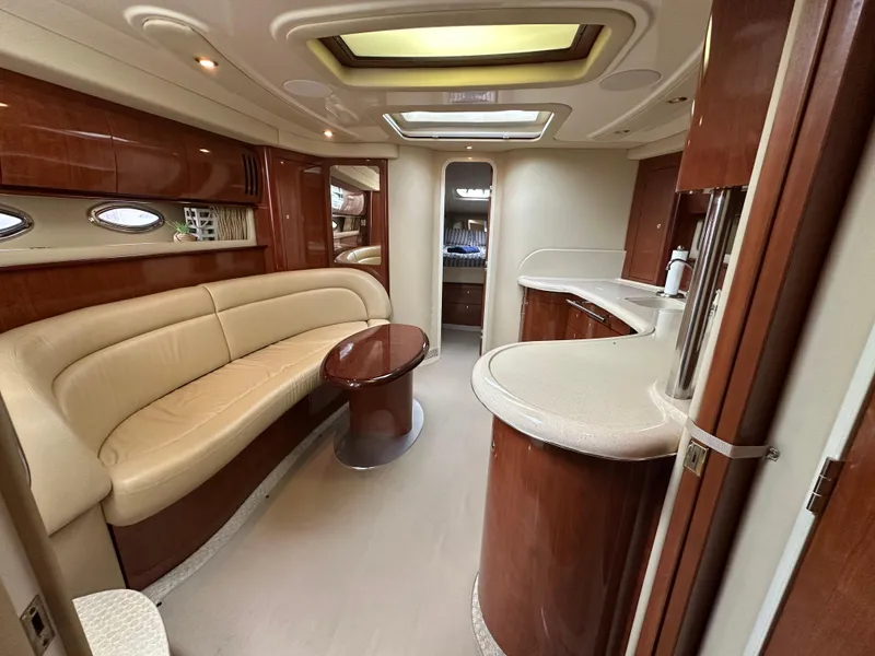 Slide: The Image of Luxurious interior of 2003 Sea Ray 420 Sundancer yacht with elegant seating and modern amenities. - 37