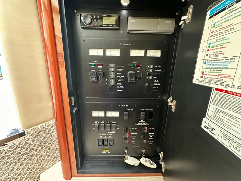 Slide: The Image of Electrical control panel inside a 2003 Sea Ray 420 Sundancer boat. - 39