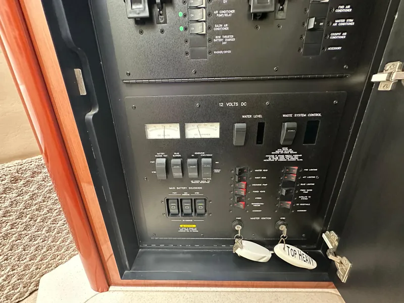 Slide: The Image of Electrical control panel on a 2003 Sea Ray 420 Sundancer yacht. - 42
