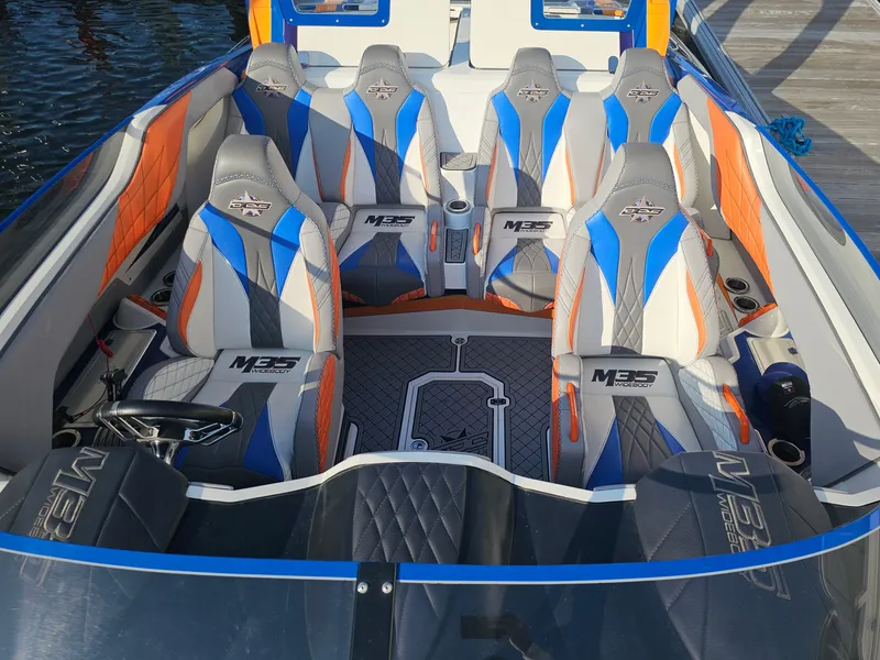 Slide: The Image of Underneath view of a 2010 Daves Custom Boats M35 on a trailer. - 24