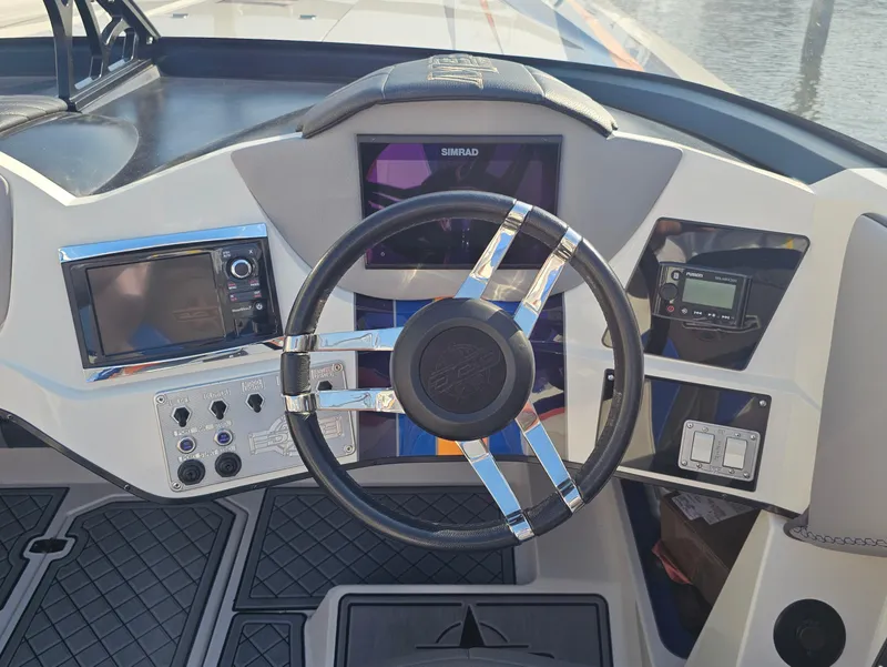 Slide: The Image of 2010 Daves Custom Boats M35 interior with vibrant blue, orange, and gray seating design. - 36