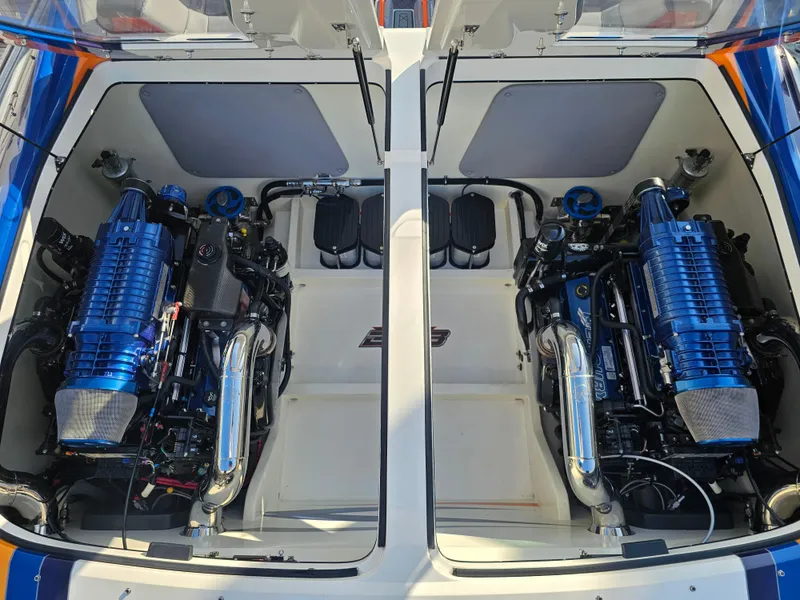 Slide: The Image of 2010 Daves Custom Boats M35 with vibrant blue and orange design on display. - 4