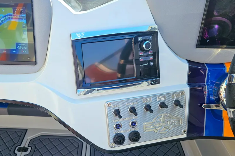 Slide: The Image of Dashboard of 2010 Daves Custom Boats M35 with navigation and control panel. - 43