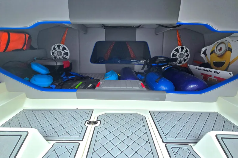 Slide: The Image of 2010 Daves Custom Boats M35 interior storage with gear and speakers. - 46