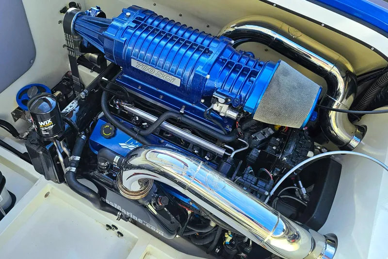 Slide: The Image of 2010 Daves Custom Boats M35 engine with blue supercharger and chrome components. - 48