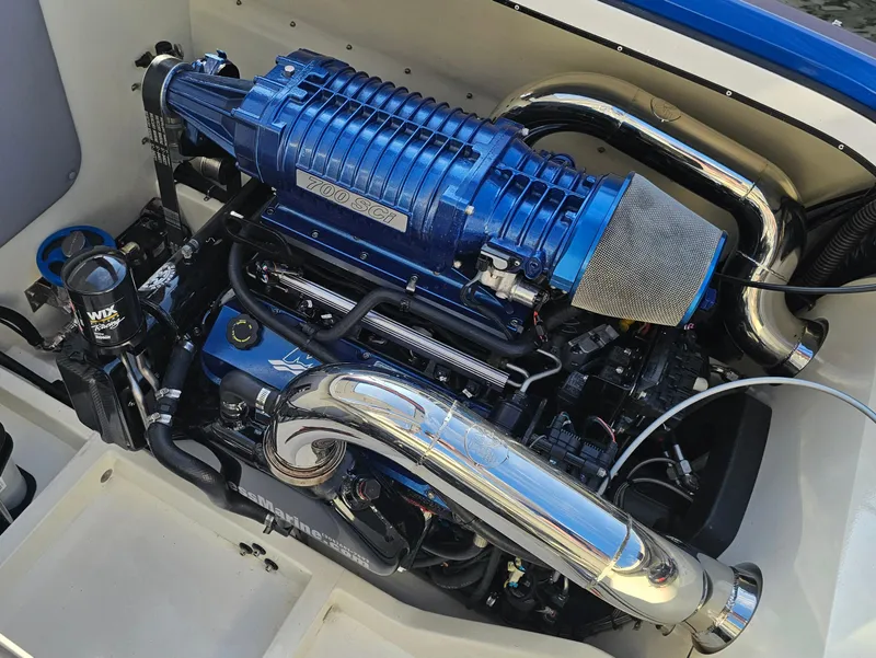 Slide: The Image of 2010 Daves Custom Boats M35 with vibrant orange accents on display. - 5