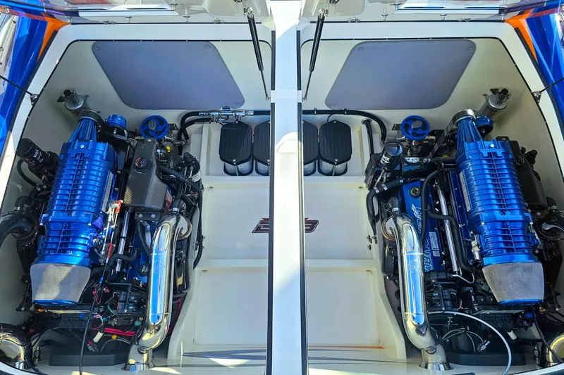 Slide: The Image of Twin engines in a 2010 Daves Custom Boats M35, showcasing powerful marine engineering. - 50
