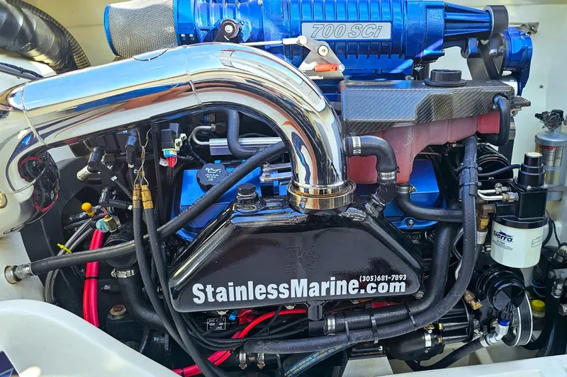 Slide: The Image of Engine of a 2010 Daves Custom Boats M35 with visible components and branding. - 52