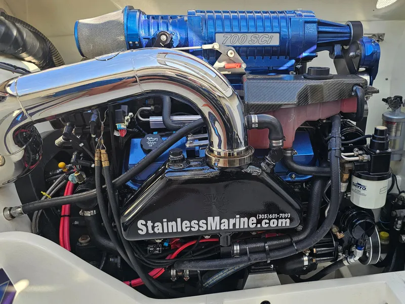 Slide: The Image of 2010 Daves Custom Boats M35 with vibrant blue, orange, and white design on display. - 8