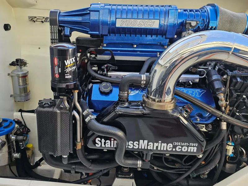 Slide: The Image of 2010 Daves Custom Boats M35 with vibrant blue and orange design on display. - 9