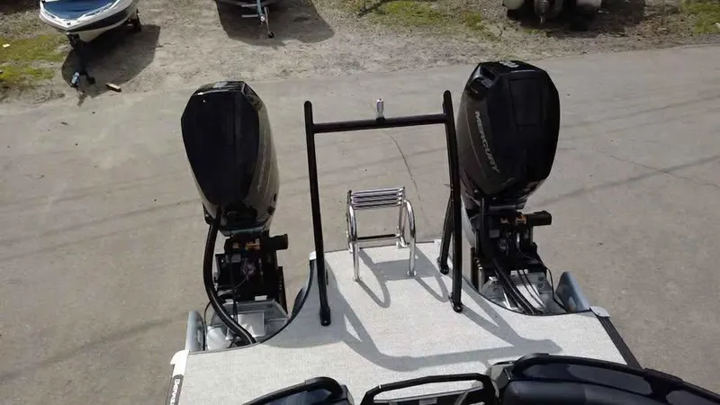 Slide: The Image of 2025 Berkshire 25 Sport RFX9-DC boat with dual Mercury outboard motors, rear view. - 10