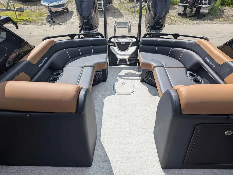 Slide: The Image of 2025 Berkshire 25 Sport RFX9-DC boat interior with luxurious seating and cup holders. - 11