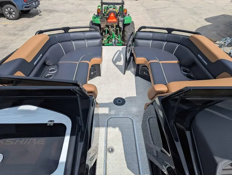 Slide: The Image of 2025 Berkshire 25 Sport RFX9-DC pontoon boat interior with luxurious seating and modern design. - 12