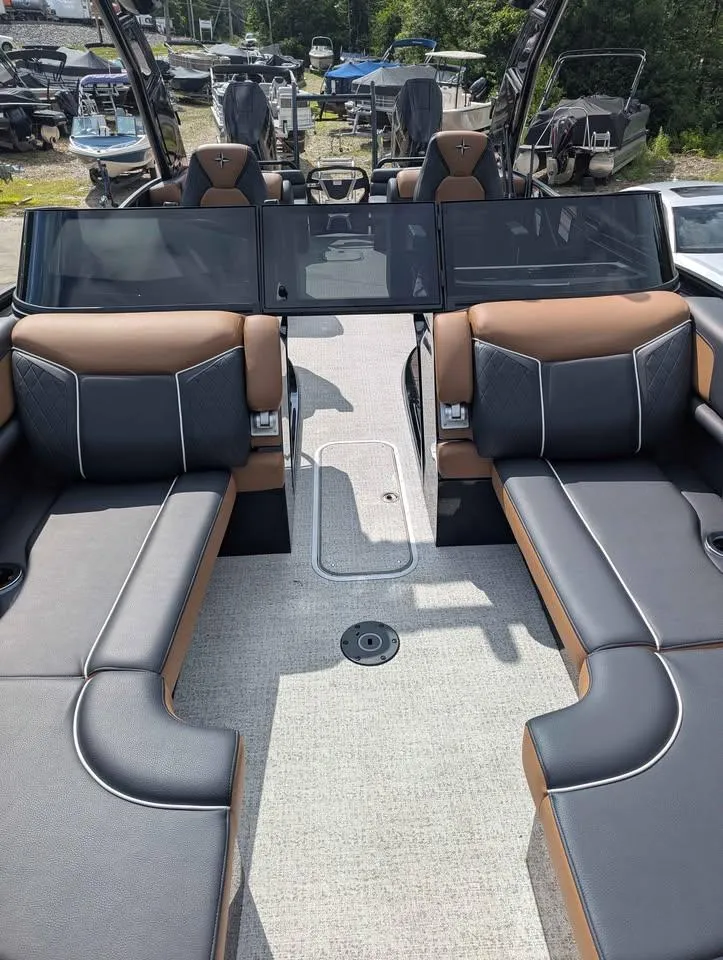 Slide: The Image of 2025 Berkshire 25 Sport RFX9-DC boat interior with luxurious seating and modern design. - 13