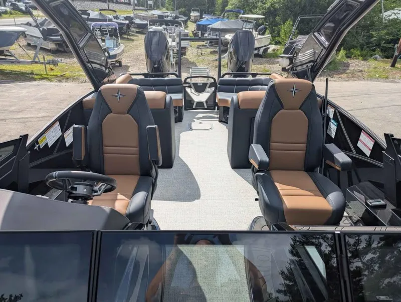 Slide: The Image of 2025 Berkshire 25 Sport RFX9-DC boat interior with luxurious seating and modern design. - 14