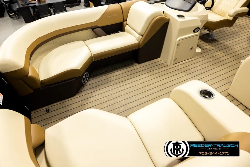 Slide: The Image of 2023 Lowe 210 SSTL boat interior with beige seating and wood-style flooring. - 10