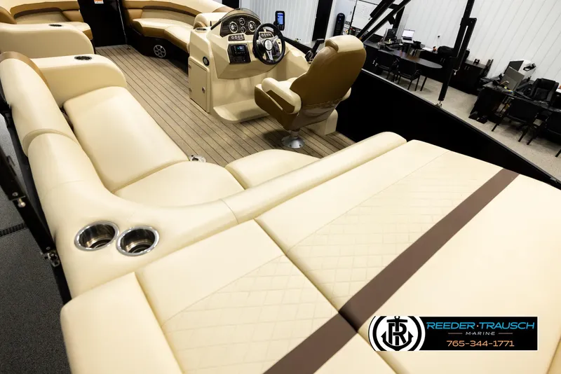 Slide: The Image of Interior of 2023 Lowe 210 SSTL boat with beige seating and steering console. - 11
