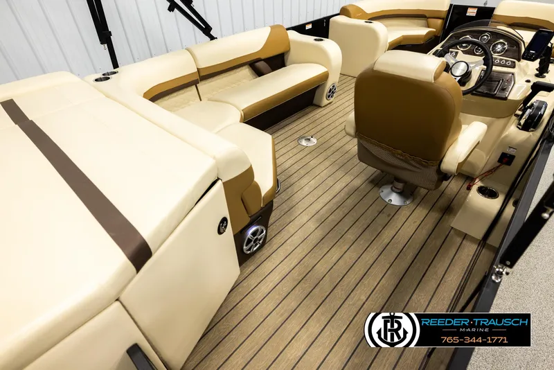 Slide: The Image of 2023 Lowe 210 SSTL boat interior with beige seating and wood-style flooring. - 12