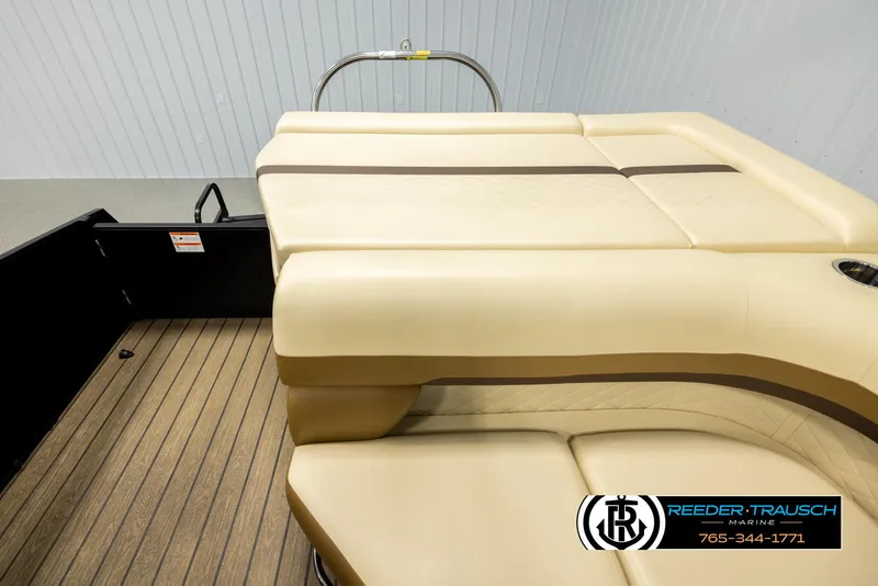 Slide: The Image of 2023 Lowe 210 SSTL boat interior with beige seating and wood-style flooring. - 15