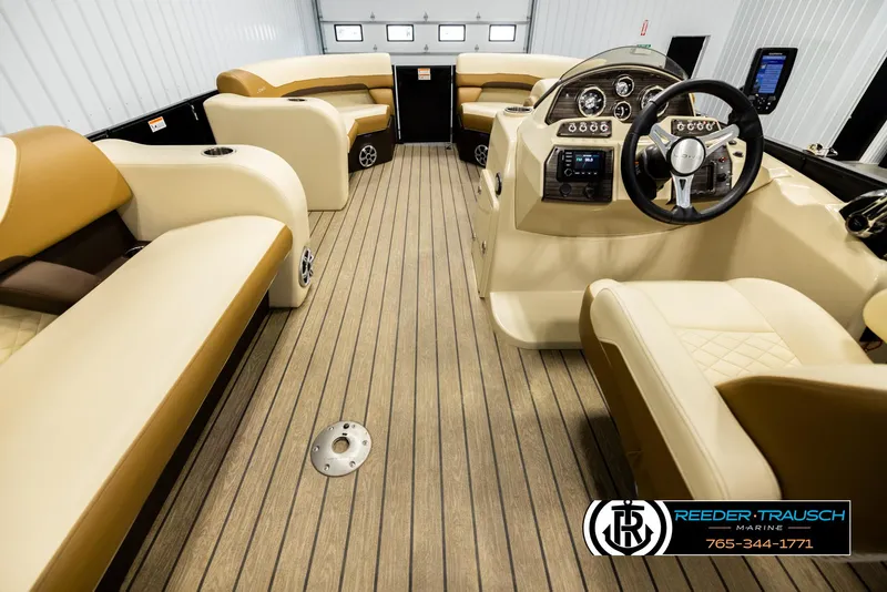 Slide: The Image of Interior of 2023 Lowe 210 SSTL boat with beige seating and modern dashboard. - 17