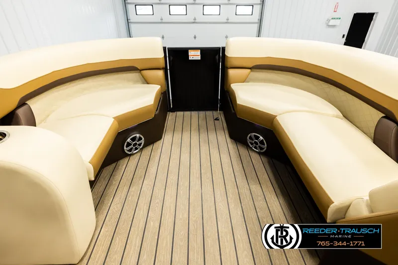 Slide: The Image of Interior of 2023 Lowe 210 SSTL boat with beige seating and wood flooring. - 18