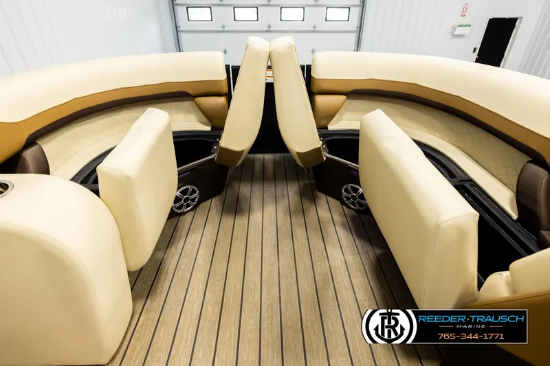 Slide: The Image of 2023 Lowe 210 SSTL boat interior with beige seating and wood flooring. - 19