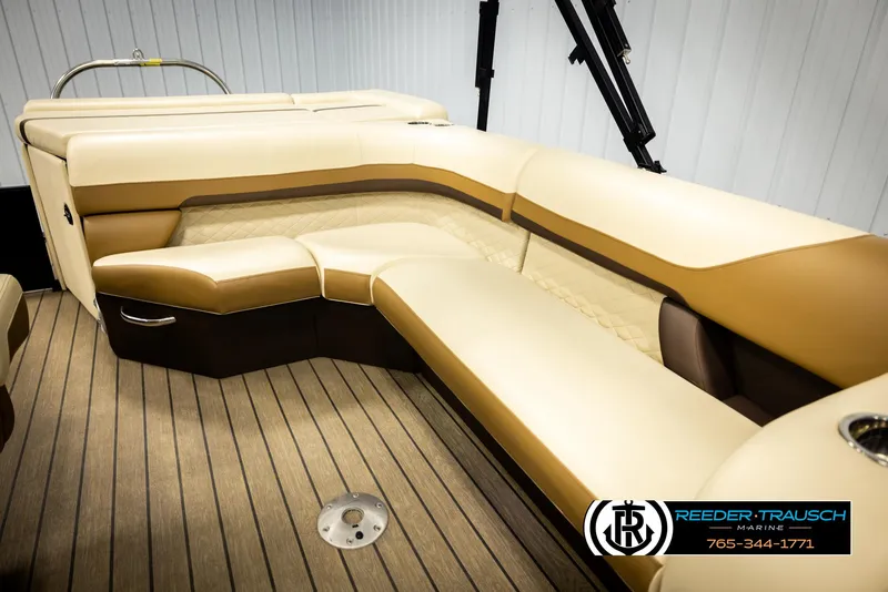Slide: The Image of 2023 Lowe 210 SSTL boat interior with beige seating and wood flooring. - 22