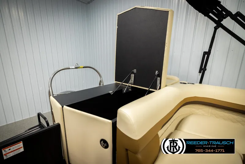 Slide: The Image of 2023 Lowe 210 SSTL boat interior with beige seating and storage compartment. - 26