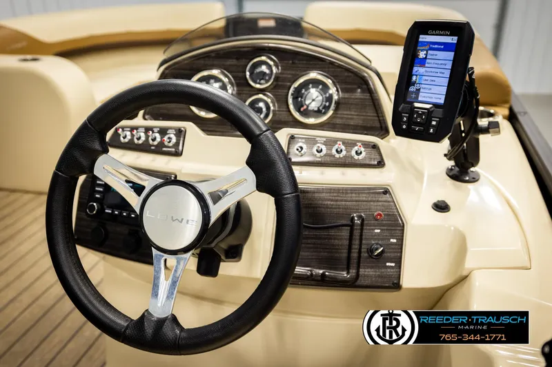 Slide: The Image of Steering console of 2023 Lowe 210 SSTL boat with Garmin navigation system. - 27