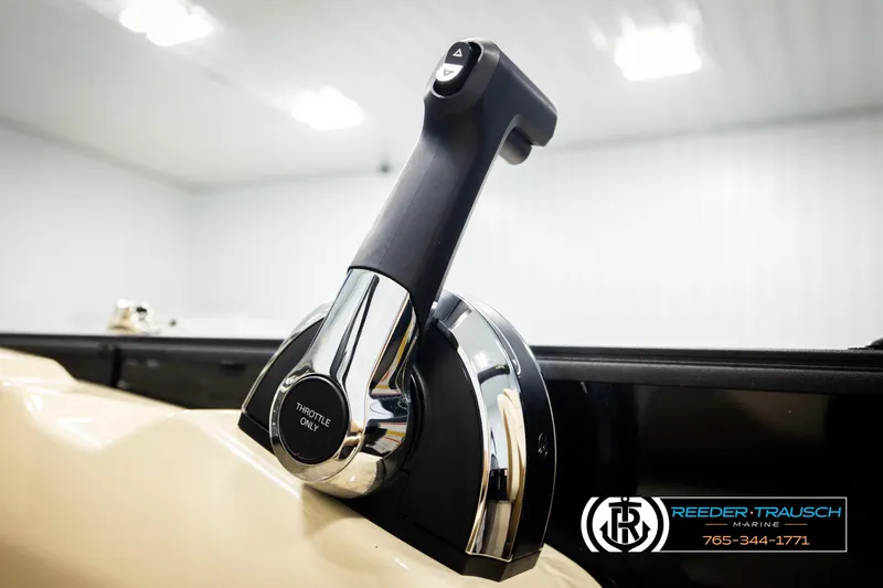 Slide: The Image of Close-up of 2023 Lowe 210 SSTL boat throttle control in a showroom. - 36