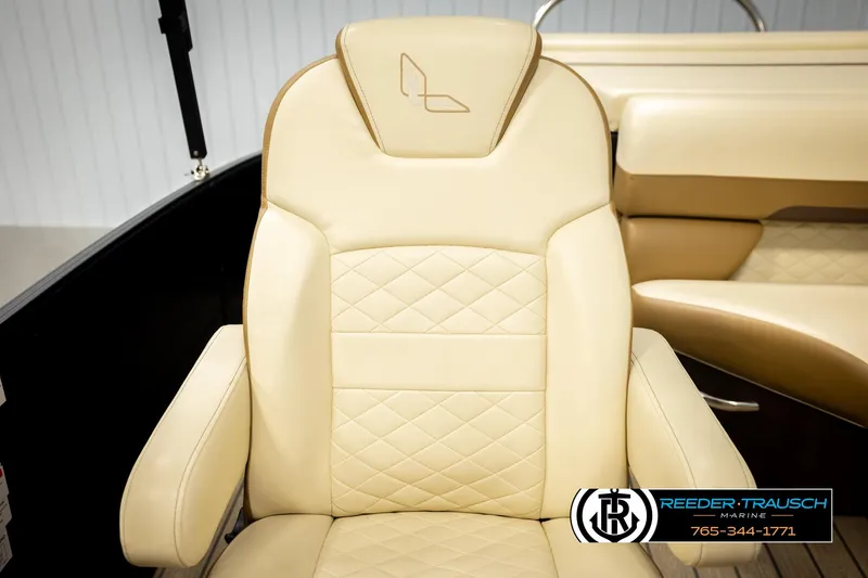 Slide: The Image of Luxurious beige seat in 2023 Lowe 210 SSTL boat, featuring diamond stitching and armrests. - 37