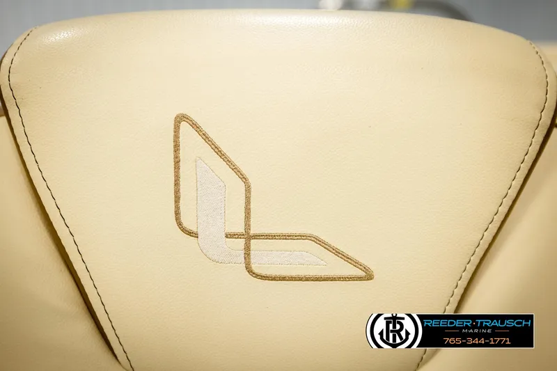 Slide: The Image of Beige leather seat with Lowe logo, 2023 Lowe 210 SSTL boat, Reeder-Trausch Marine branding. - 38
