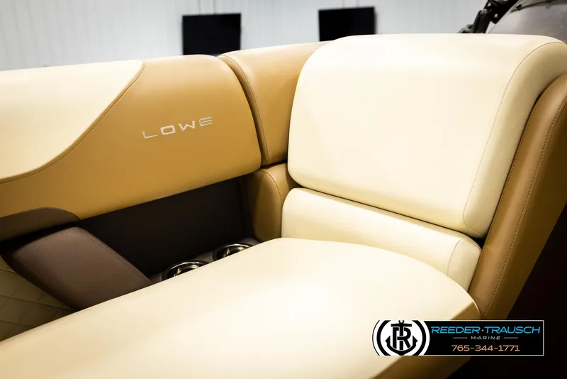 Slide: The Image of Luxurious tan and cream seating in 2023 Lowe 210 SSTL boat, Reeder-Trausch Marine logo visible. - 39