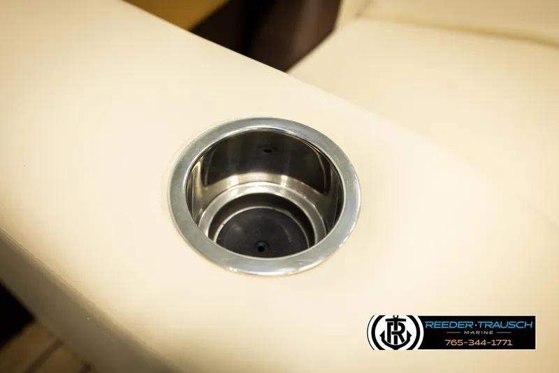 Slide: The Image of Cup holder on 2023 Lowe 210 SSTL boat, beige upholstery, Reeder-Trausch Marine logo. - 42