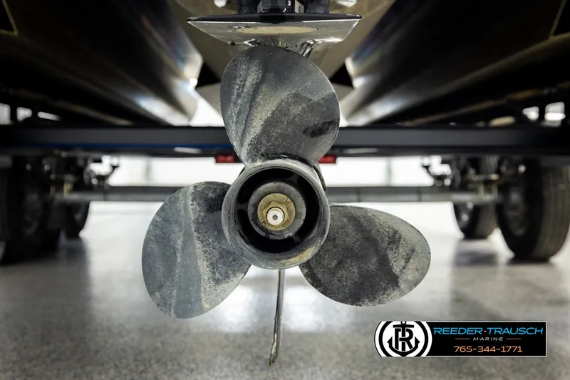 Slide: The Image of Propeller of 2023 Lowe 210 SSTL boat on trailer, Reeder-Trausch Marine logo visible. - 47
