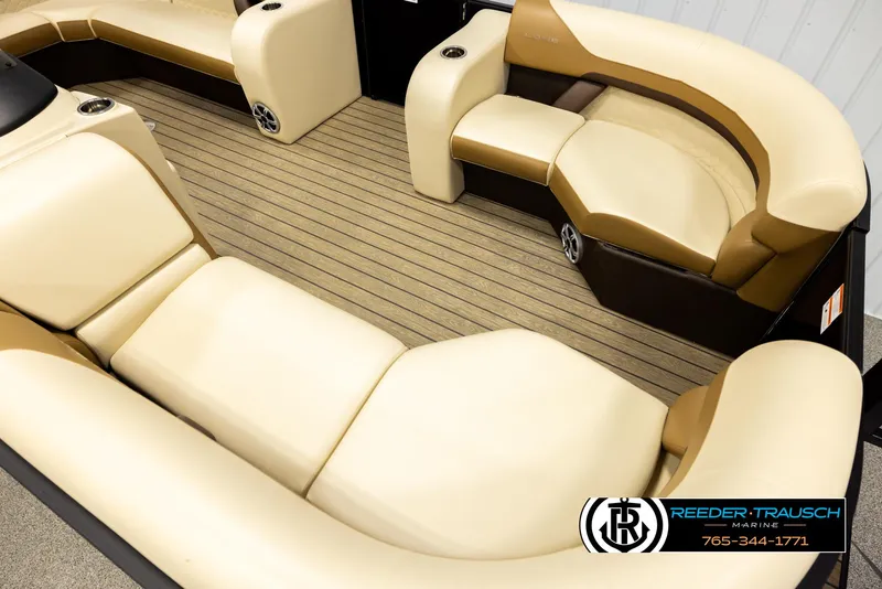 Slide: The Image of Interior of 2023 Lowe 210 SSTL boat with beige seating and wood-style flooring. - 9