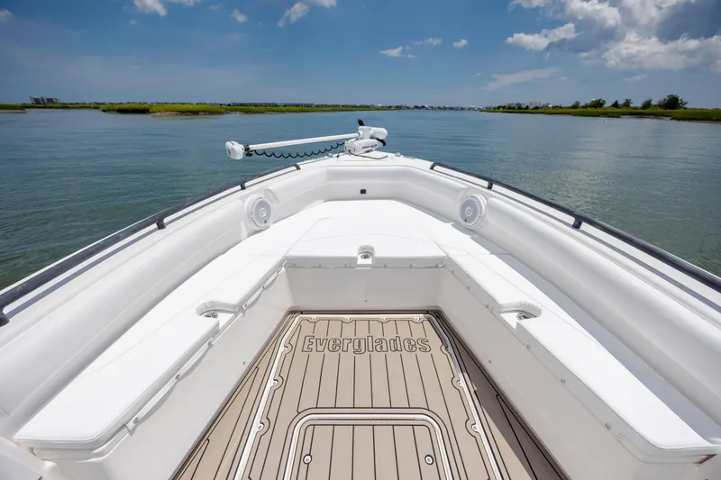 Slide: The Image of 2015 Everglades 243 Center Console boat on calm water under blue sky. - 18