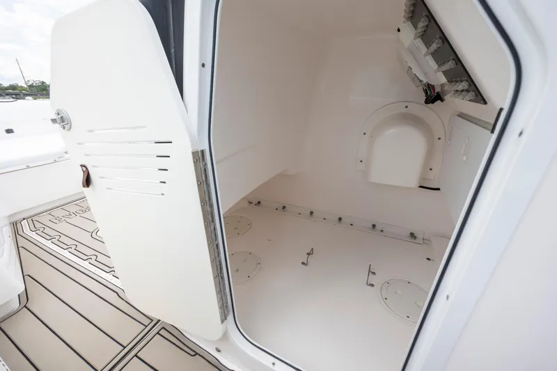 Slide: The Image of Interior view of 2015 Everglades 243 Center Console boat storage compartment. - 20