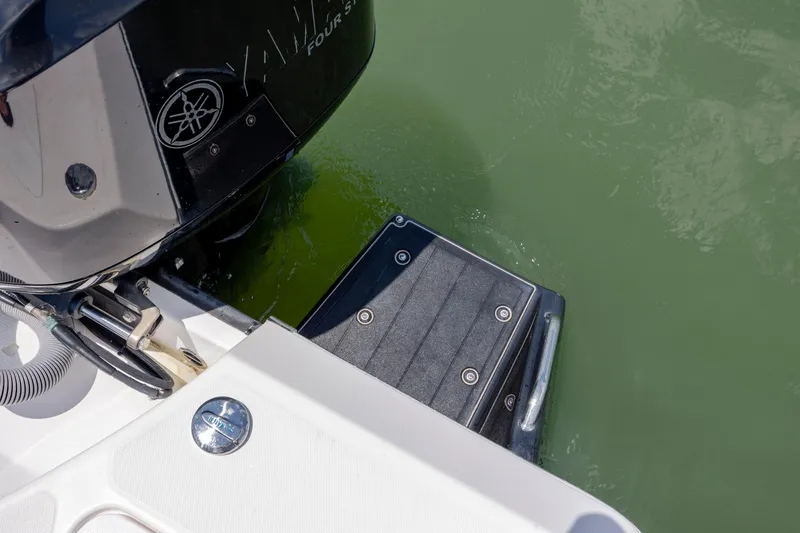 Slide: The Image of 2015 Everglades 243 Center Console boat with Yamaha engine and swim platform. - 25